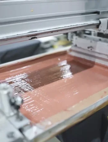 Clothing Manufacturers – High-Quality Garments - printing machine close up image